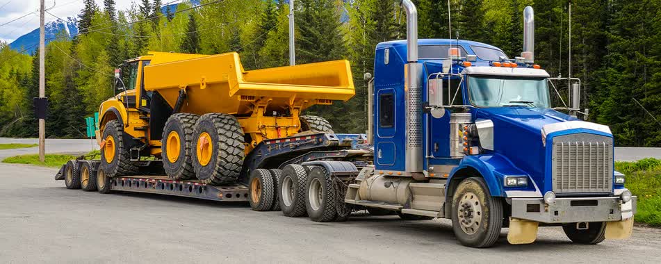 重型设备运输指南:购买后如何安全高效地运输设备 重型设备运输指南:购买后如何安全高效地运输设备